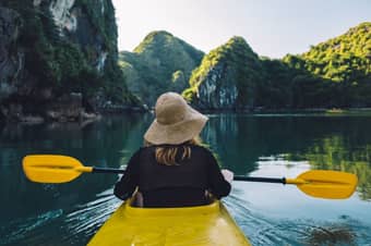 Tourist cruising through the serene waters of Mekong Delta